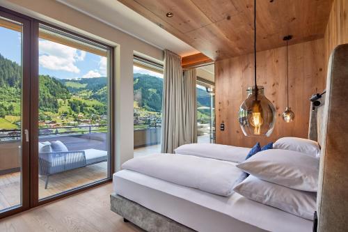 Posteľ alebo postele v izbe v ubytovaní DAS EDELWEISS - Salzburg Mountain Resort