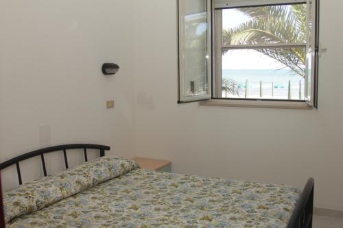 Ένα ή περισσότερα κρεβάτια σε δωμάτιο στο Albergo 2 Pini