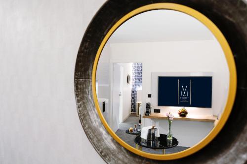 
a reflection of a mirror in a bathroom at Grand Hotel Bregenz - MGallery Hotel Collection in Bregenz
