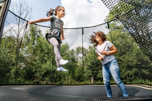 two girls jumping on a trampoline at Hunter Vip in Reghin