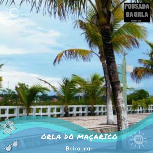 a picture of a palm tree next to a swimming pool at Pousada da Orla in Salinópolis