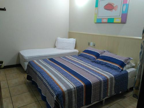 Cama ou camas em um quarto em Pousada Praia D'Azul