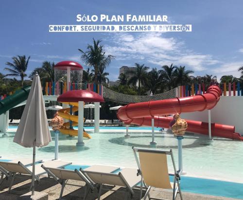 a water park with a slide in the water at Villa Privada ubicada en el campo de Golf del Hotel Vidanta Mayan Palace in Acapulco