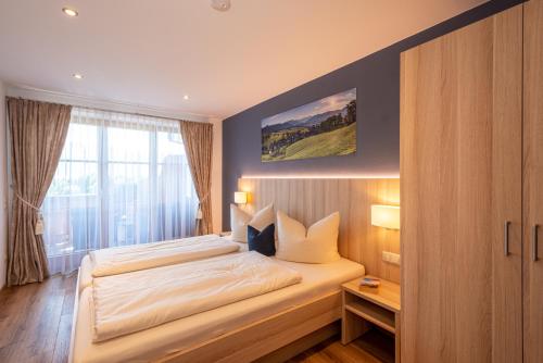 Katil atau katil-katil dalam bilik di Aparthotel Werdenfels