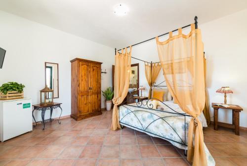 Tempat tidur dalam kamar di Oasi Caprolace