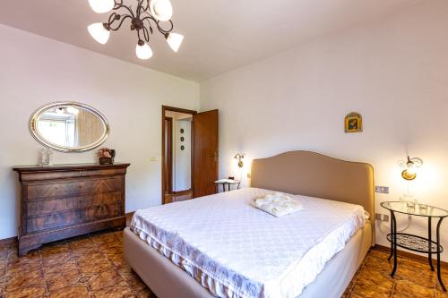 Casa Damiano tesisinde bir odada yatak veya yataklar