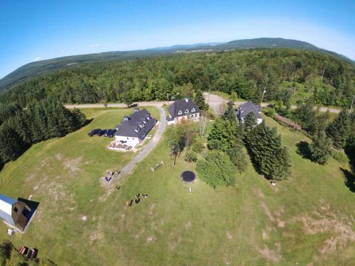 an aerial view of a large house on a hill at Domaine Montauban in Saint Fortunat