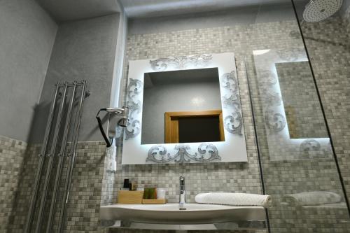 a bathroom with a sink and a mirror at Bed&Bike Prachatice in Prachatice