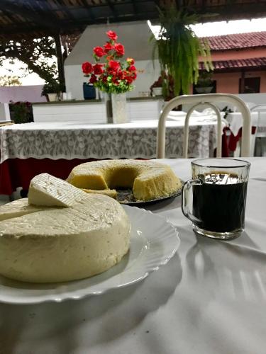 a table with two slices of bread on a plate at Hotel Campina in Posse