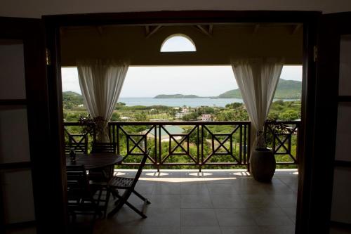 a view from a room with a table and chairs at Villa Touloulou in English Harbour Town