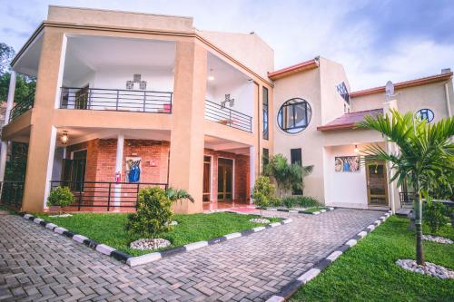 a large house with a courtyard in front of it at High Ground Villa Ltd in Kigali