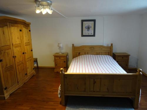 Кровать или кровати в номере Sneeuweifel