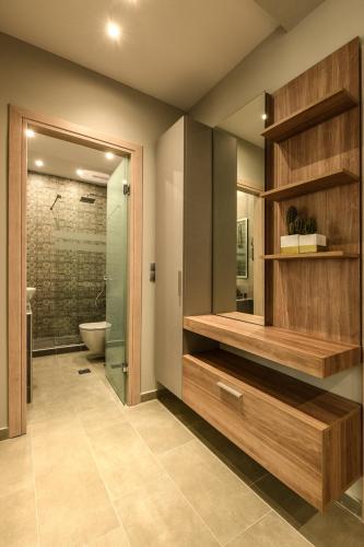 a bathroom with a toilet and a glass shower at Sunny Luxury Suite Grey in Kavála