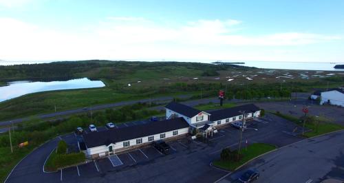 an aerial view of a building with a parking lot at Econo Lodge Inn & Suites in Saint John