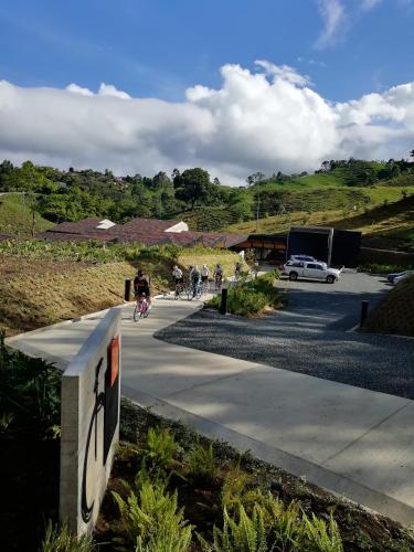 a group of people riding bikes on a sidewalk at Casa Du Vélo in Filandia