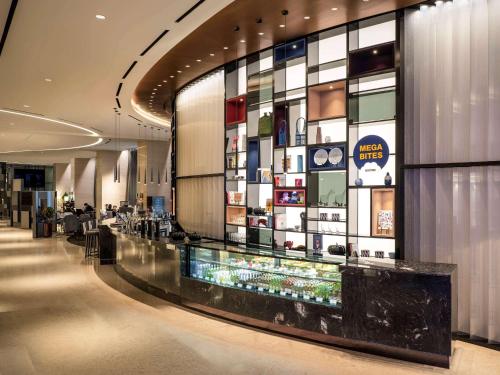 a lobby of a hotel with a display of cosmetics at Novotel Suites Ambassador Seoul Yongsan in Seoul