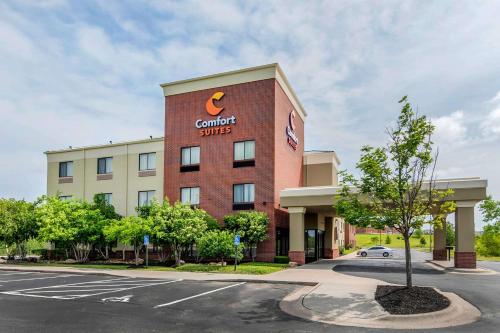 a building with a cambria suites sign on it at Comfort Suites Speedway - Kansas City in Kansas City