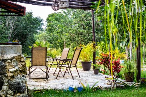 a group of chairs sitting on a patio at Aldea Isla Sagrada in Cozumel