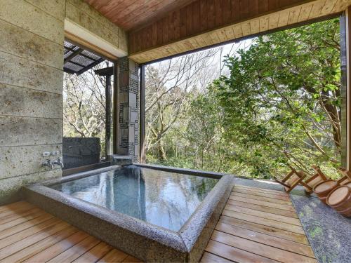 an indoor pool in the middle of a house at Nagataki in Nakatsugawa