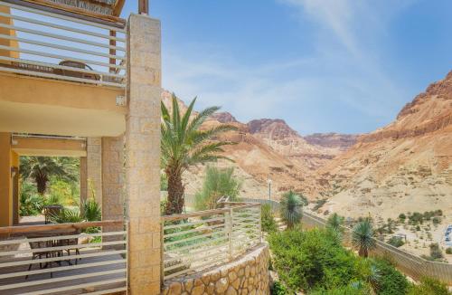 a house in the desert with a view of the mountains at Ein Gedi Kibbutz Hotel in Ein Gedi