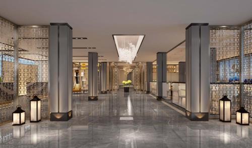 a lobby of a building with columns and lights at Ocean Delight Boutique Hotel 海悦精品酒店 in Sihanoukville