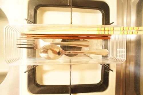 a clear drawer with utensils in a refrigerator at Plusone Fujisaki in Fukuoka