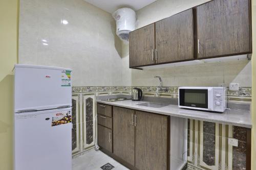 Cucina o angolo cottura di شهد الاولى للشقق المخدومة - فئة اقتصادي