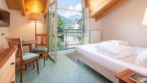 Säng eller sängar i ett rum på Hotel Villa Laurus