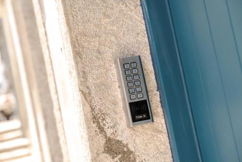 a remote control on the side of a door at Sta Catarina Design Apartments by Lisbon One in Lisbon