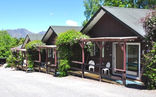 a row of cottages with plants on them at Greenacres Alpine Chalets & Villas in Hanmer Springs