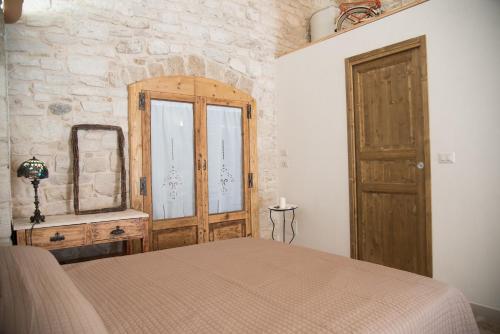 Postel nebo postele na pokoji v ubytování Piazza Duomo - Medieval Puglia's House