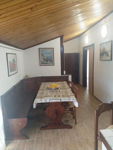 a dining room with a table and a couch at A due passi in Arezzo