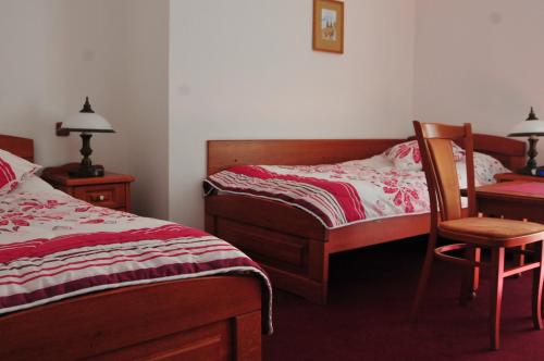 Postel nebo postele na pokoji v ubytování Hotel Pegas Brno