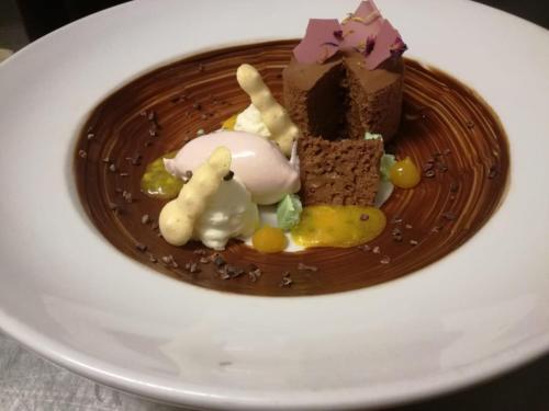 a chocolate dessert on a plate on a table at Genussgasthof Willenshofer in Sankt Kathrein am Hauenstein