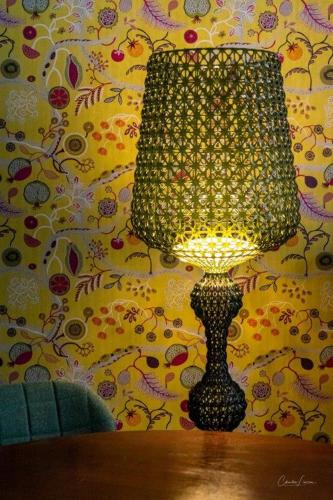 a lamp sitting on a table in a room at Slot Oostende in Goes