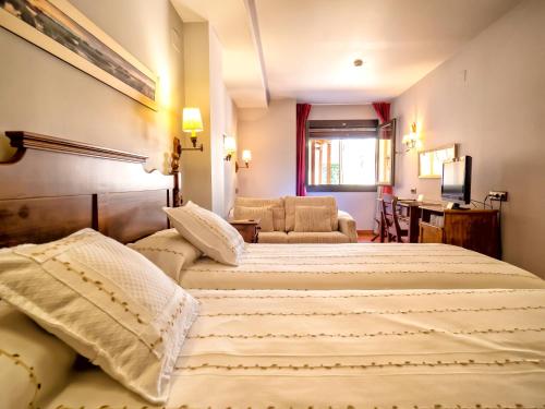 Кровать или кровати в номере Hotel Doña Manuela