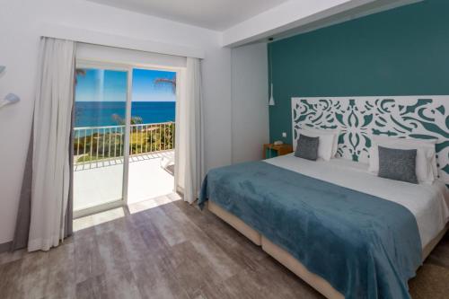 Ένα ή περισσότερα κρεβάτια σε δωμάτιο στο Mareta View - Boutique Bed & Breakfast