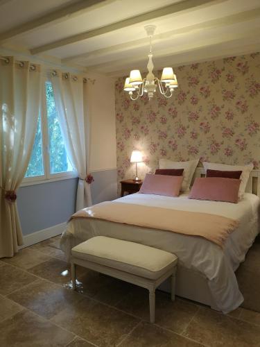 Säng eller sängar i ett rum på Le Mas des Agapes