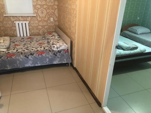 Postel nebo postele na pokoji v ubytování Гостиный Дом Comfort