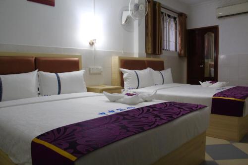 Cama ou camas em um quarto em Don Bosco Guesthouse