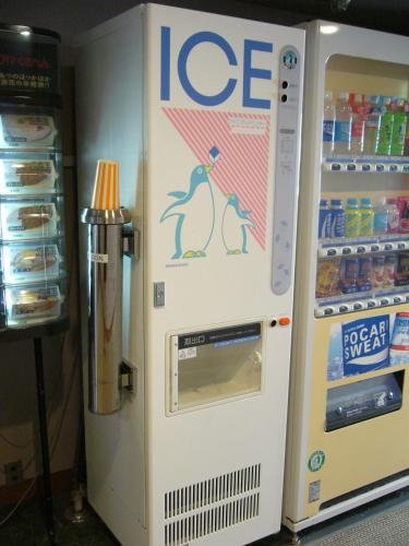 a ice machine with a penguin on it next to a refrigerator at Pearl Hotel Ryogoku in Tokyo