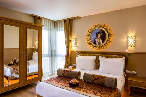 Ένα ή περισσότερα κρεβάτια σε δωμάτιο στο Hotel Sultania Boutique Class