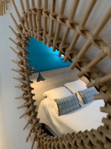 a bedroom with a bed in a wooden room at Logis Hôtel La Fenière in La Bouilladisse