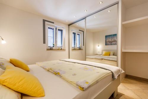 Ένα ή περισσότερα κρεβάτια σε δωμάτιο στο Ferienwohnungen Velijoze
