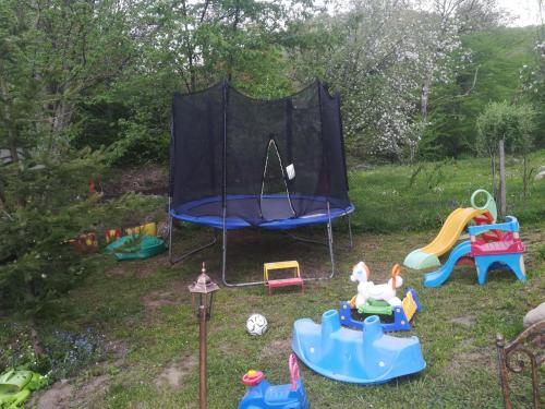 a group of childrens play equipment in a yard at Villa Bulgarka in Divchovoto
