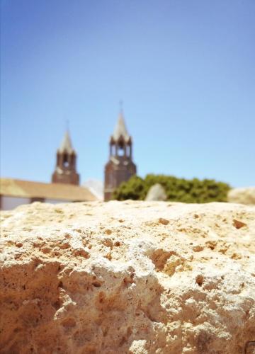 a loaf of bread with two towers in the background at Old Town SXVI - Adults Only in Telde