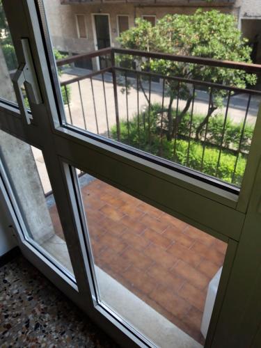 an open door with a view of a patio at G&A Milan House CIR 03041 in Milan