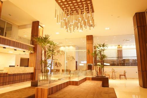 a lobby with a chandelier in a building at Forte Express in Macapá