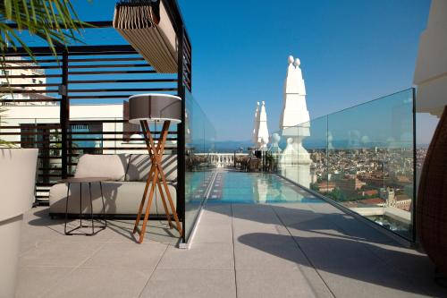 a balcony with a view of a city at Riu Plaza España in Madrid