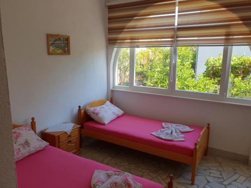 Ένα ή περισσότερα κρεβάτια σε δωμάτιο στο Apartments Alma